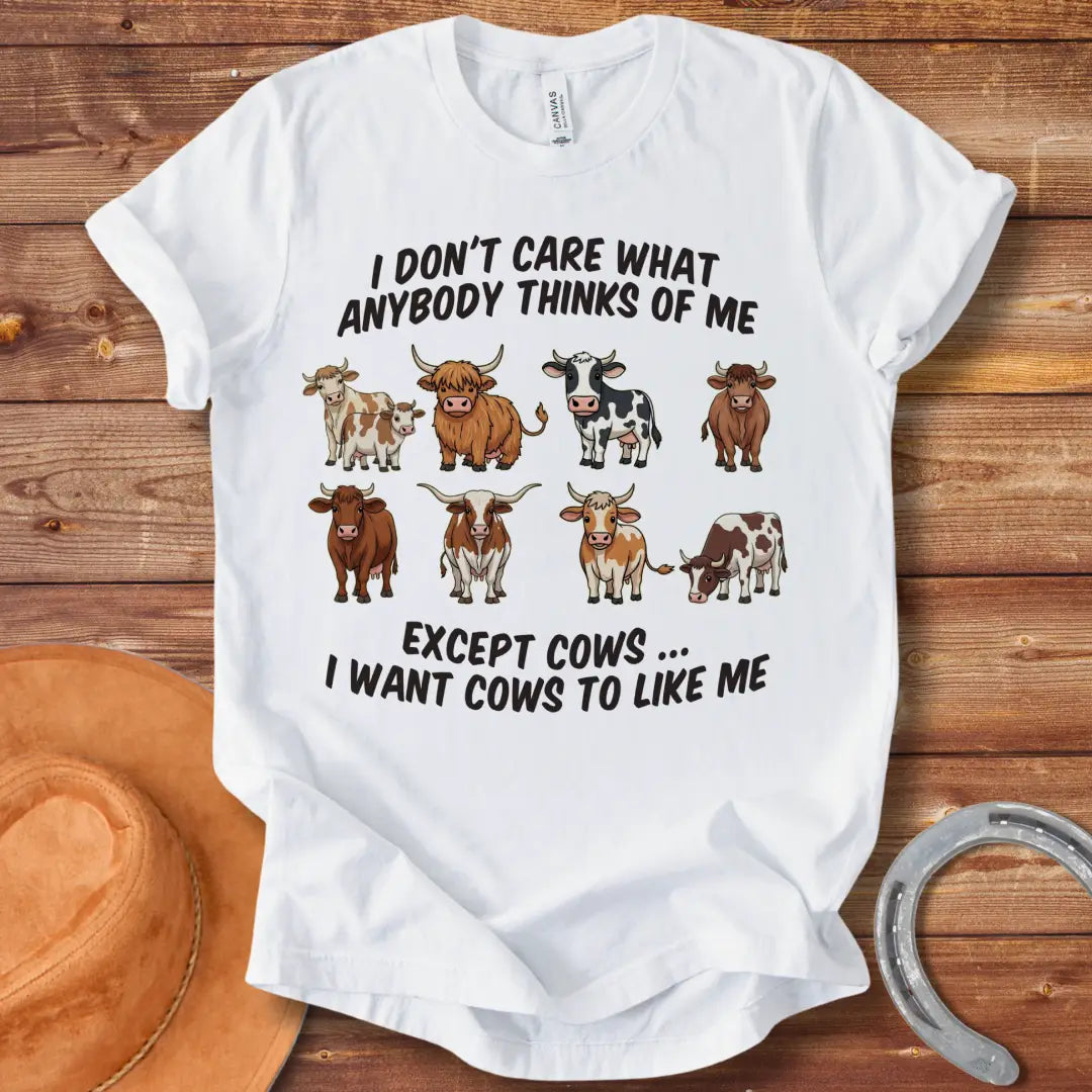 T-shirt design featuring multiple cartoon cow breeds with the phrase 'I Don't Care About Anybody Except Cows' on a black background.