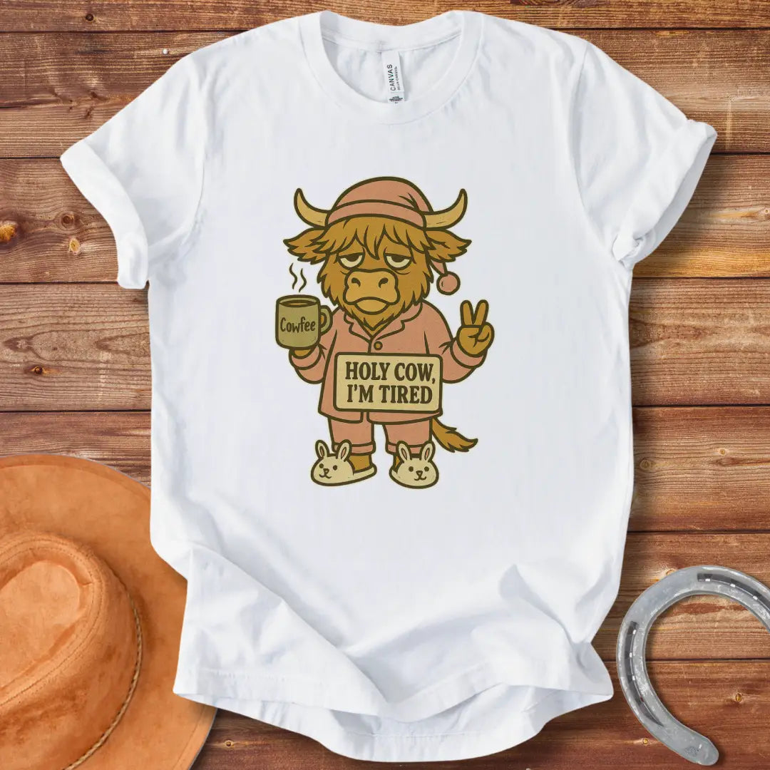 Illustration of a tired cow in pajamas holding a coffee mug that says 'Cowfee,' holding up a peace sign, and wearing bunny slippers. Text on the cow's sign reads 'Holy Cow, I'm Tired.'