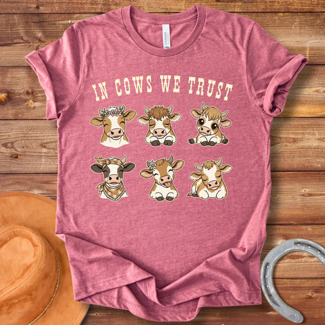 In Cows We Trust t-shirt featuring an illustration of six cute cows with different personalities.