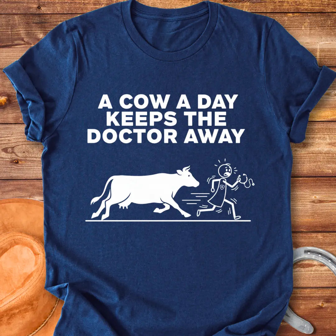 Black t-shirt design with a cow illustration and the text 'A Cow a Day Keeps the Doctor Away'