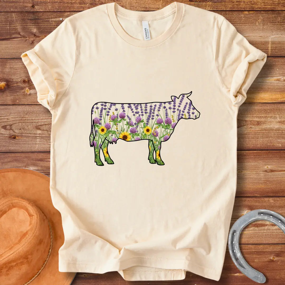 Silhouette of a cow filled with lavender, sunflowers, and clover flowers.