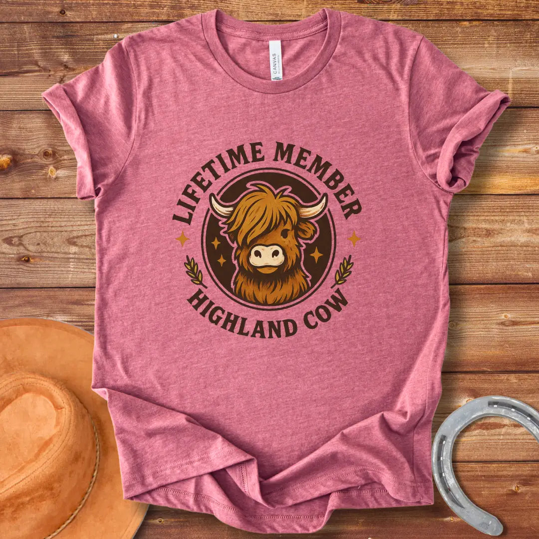 Lifetime Member Highland Cow T-Shirt design featuring a friendly and fluffy Highland cow face inside a circular badge.