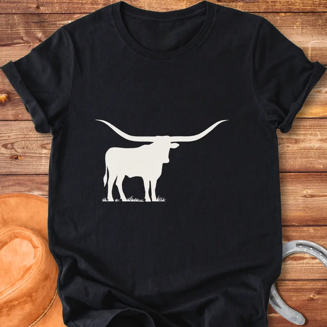 Silhouette of a longhorn on a prairie background, perfect for cow lovers.