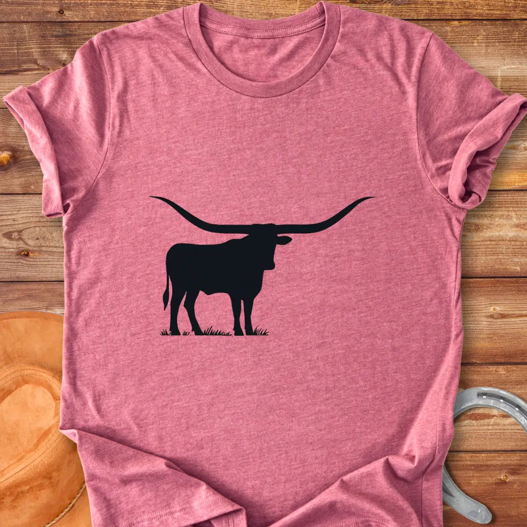 Silhouette of a longhorn on a prairie background, perfect for cow lovers.