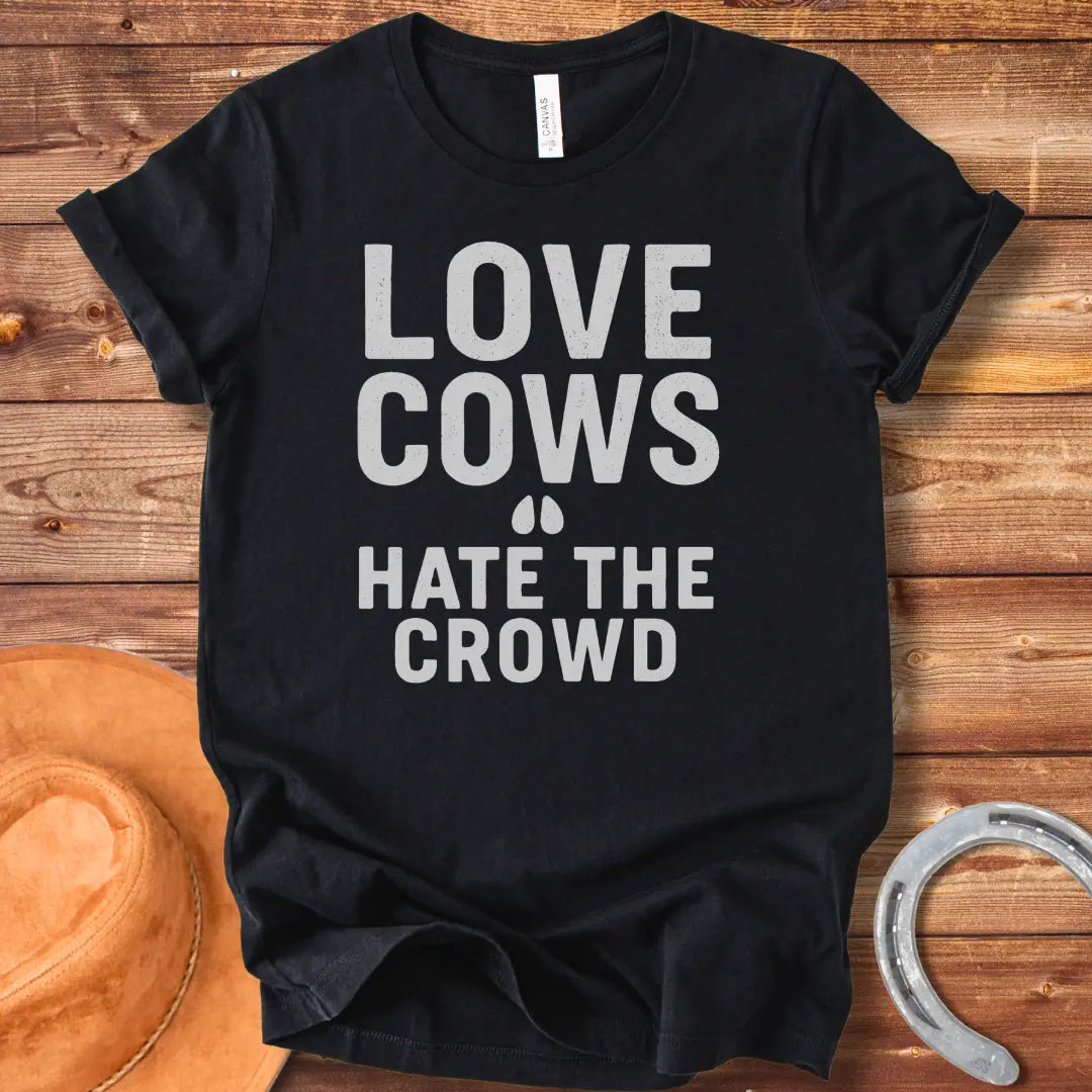 Black text on a black background reads, 'LOVE COWS' with two small hoof prints underneath and the words 'HATE THE CROWD' below.