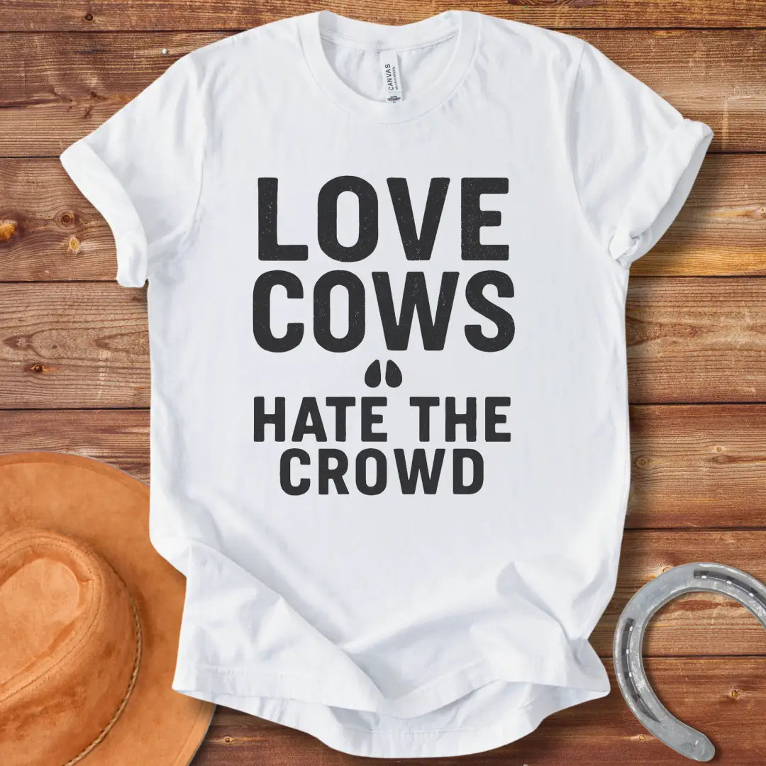 Black text on a black background reads, 'LOVE COWS' with two small hoof prints underneath and the words 'HATE THE CROWD' below.