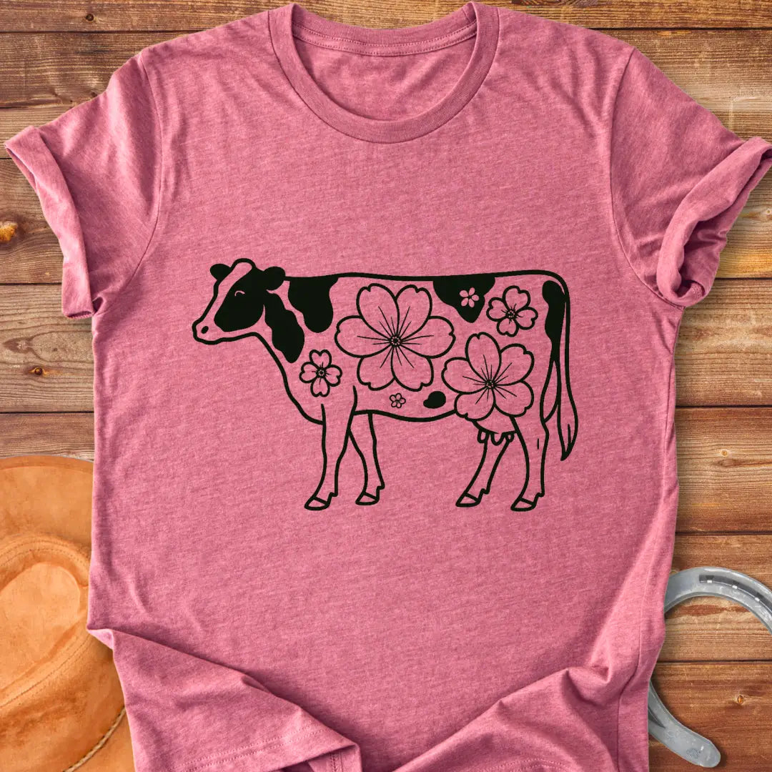 Magnolia Holstein T-Shirt featuring a Holstein cow silhouette with floral design