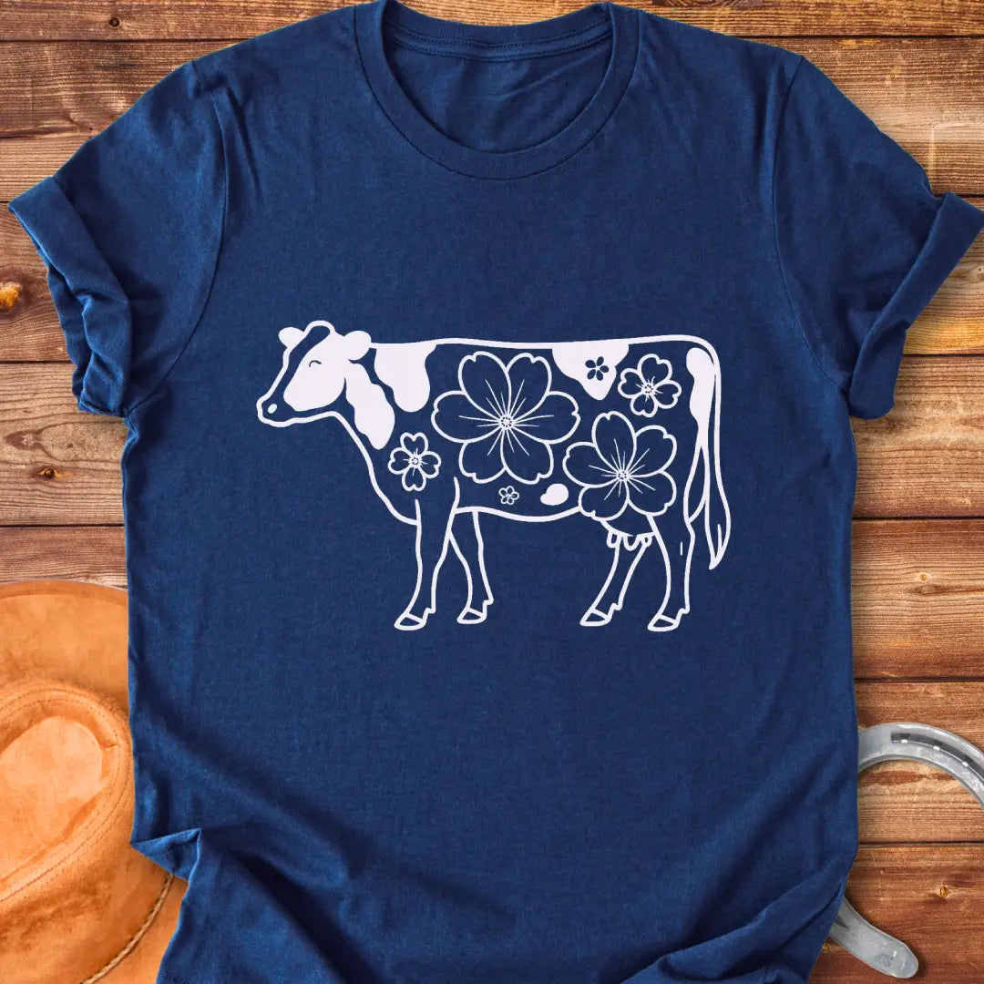 Magnolia Holstein T-Shirt featuring a Holstein cow silhouette with floral design