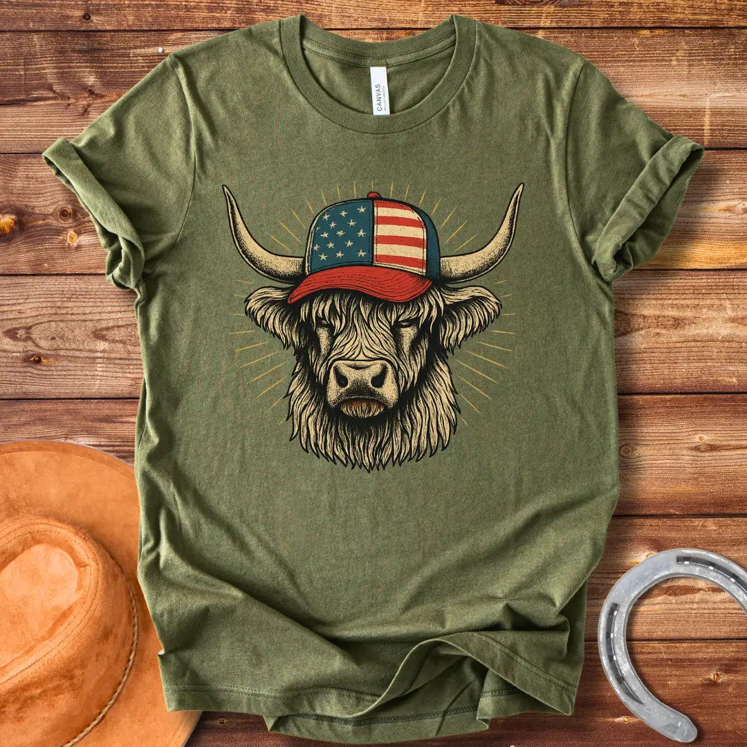 Illustration of a Highland cow wearing an American flag baseball cap, with sun rays emanating from behind the cow's head.
