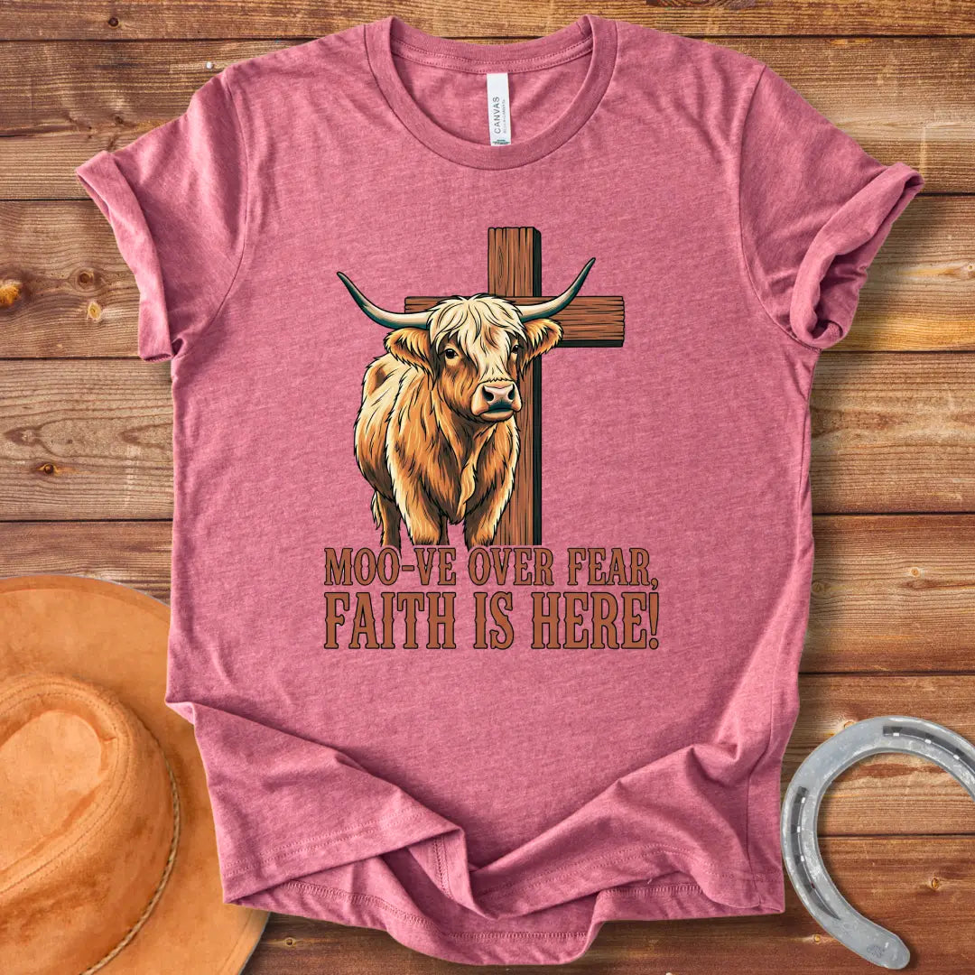 Cow standing in front of a wooden cross with the text 'Moo-ve Over Fear, Faith Is Here!'
