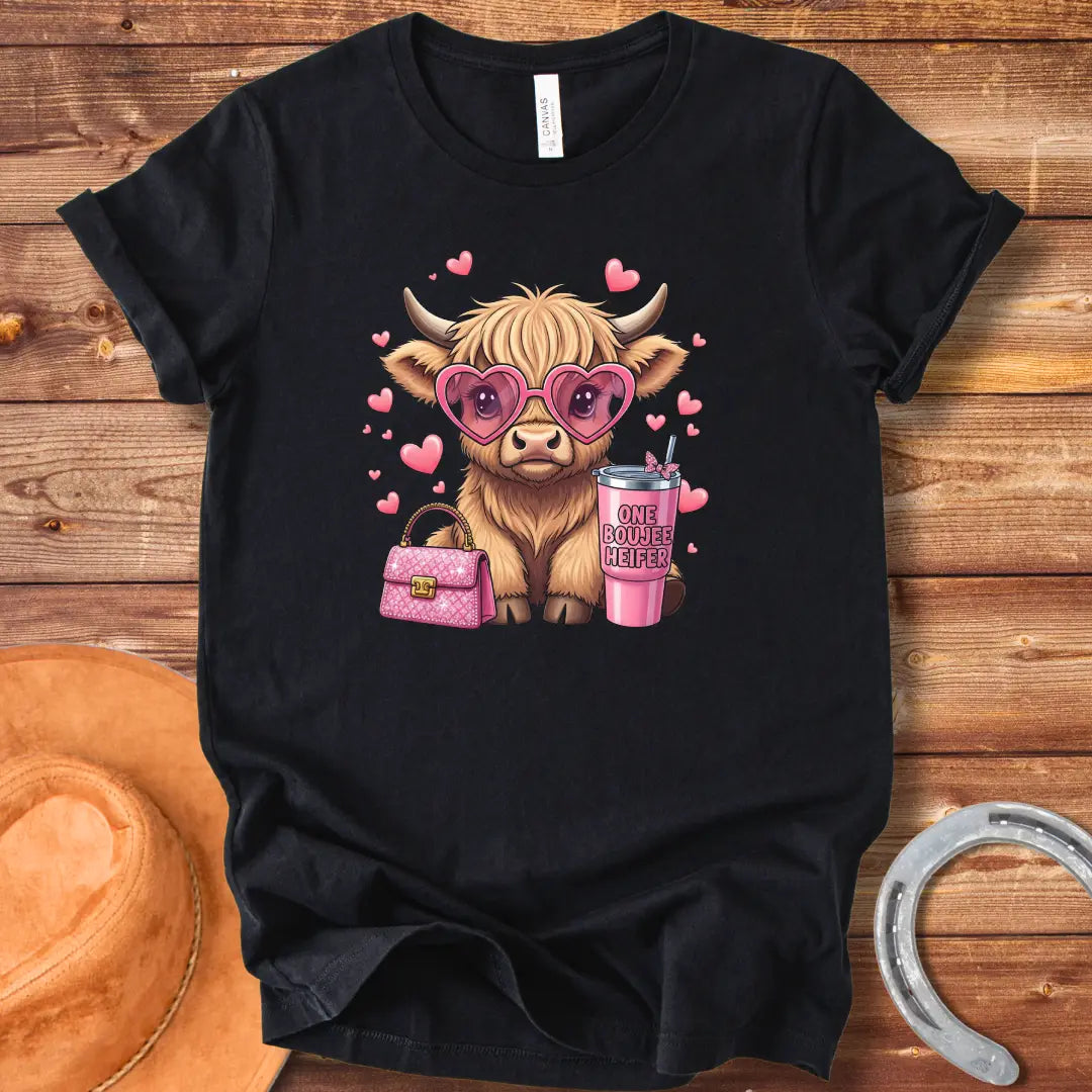 Illustration of a fluffy cow wearing heart-shaped sunglasses and holding a pink drink and purse that says 'One Boujee Heifer' with pink hearts surrounding it.