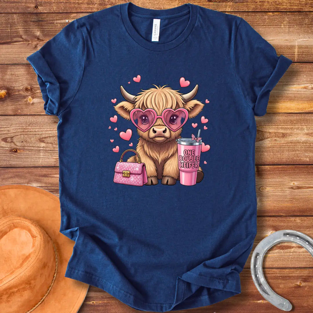 Illustration of a fluffy cow wearing heart-shaped sunglasses and holding a pink drink and purse that says 'One Boujee Heifer' with pink hearts surrounding it.