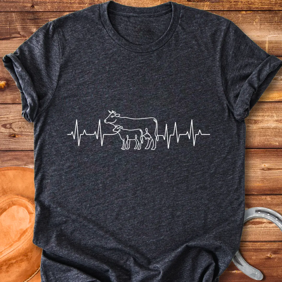 Pasture Heartbeat T-Shirt design featuring a cow and calf within a heartbeat graphic.