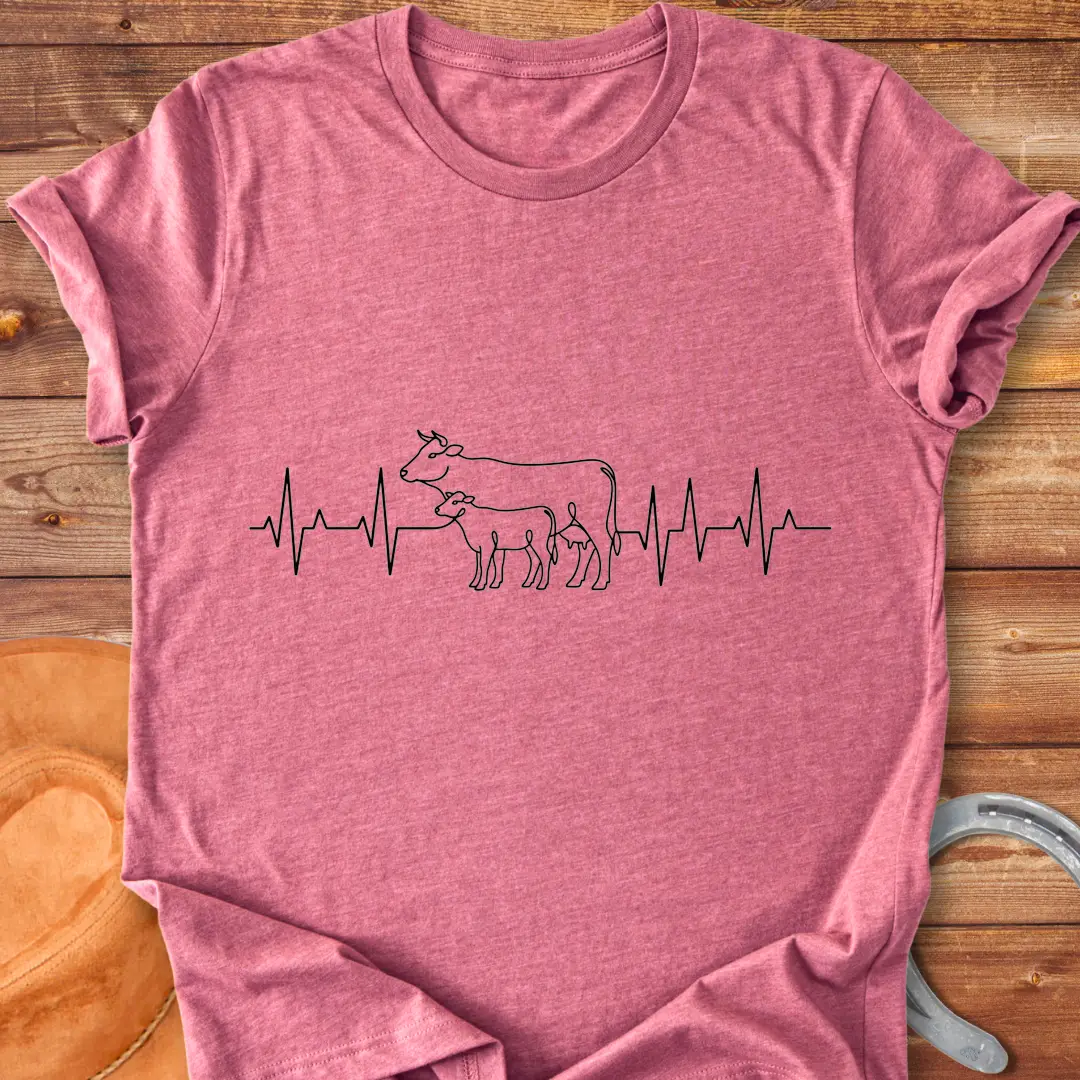 Pasture Heartbeat T-Shirt design featuring a cow and calf within a heartbeat graphic.