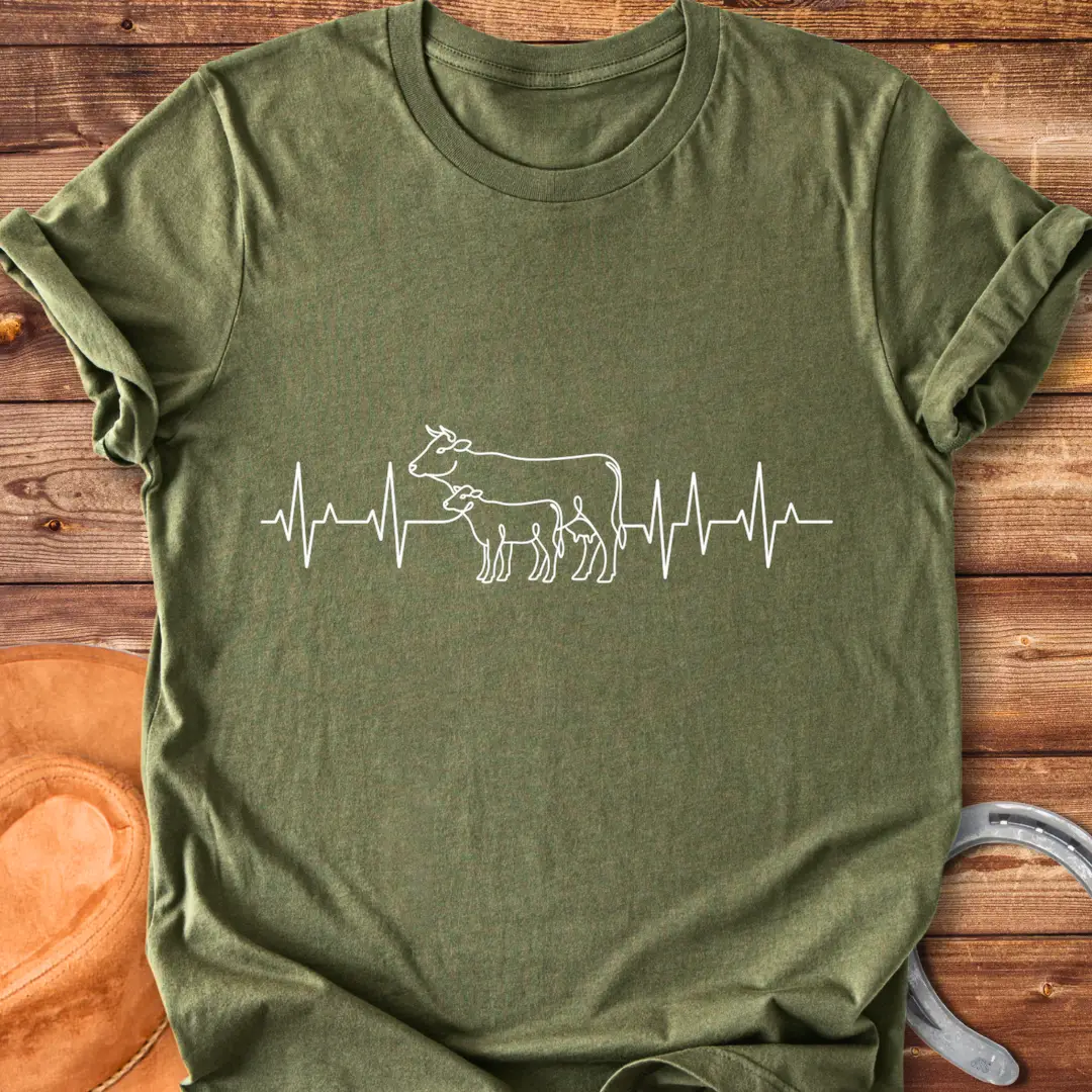 Pasture Heartbeat T-Shirt design featuring a cow and calf within a heartbeat graphic.