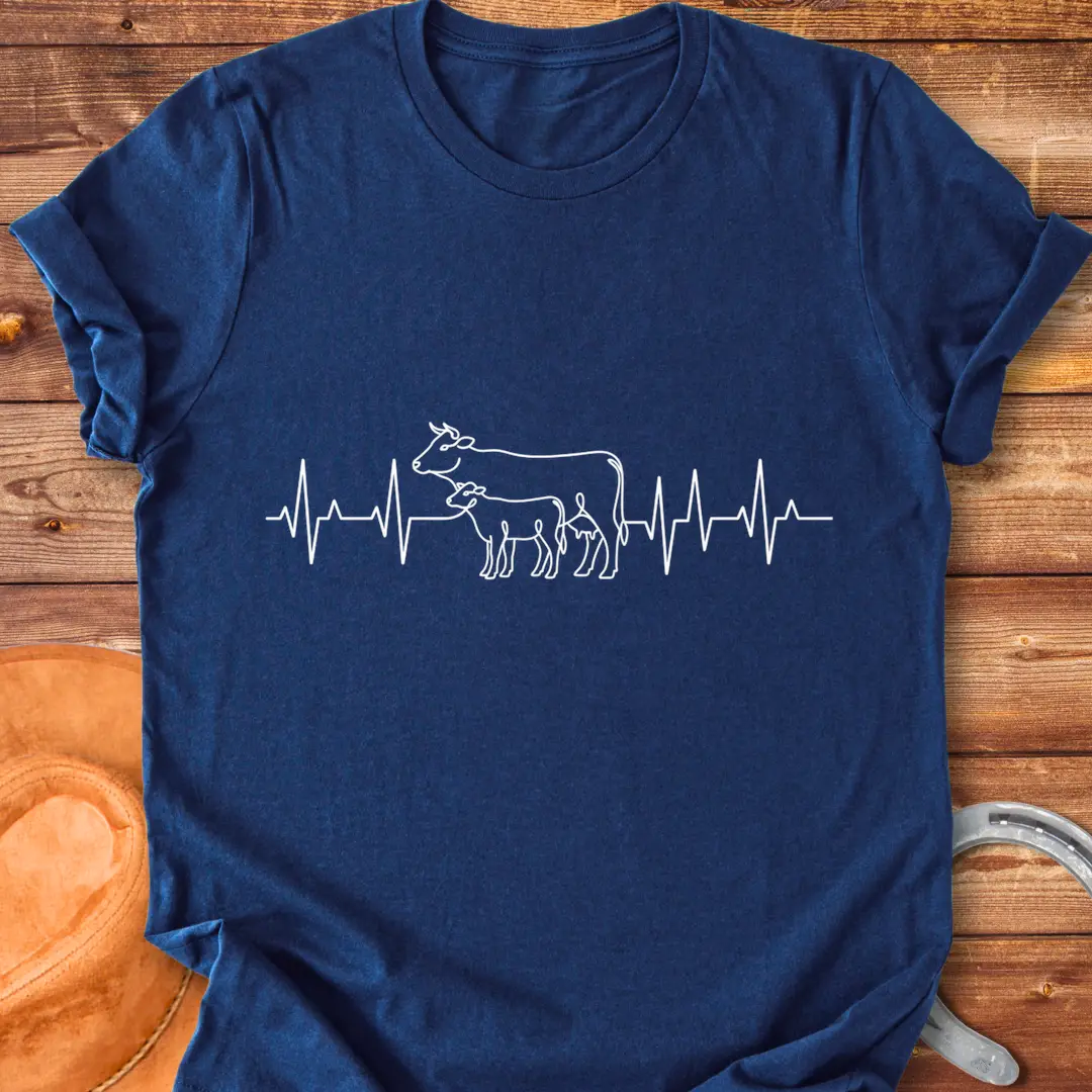 Pasture Heartbeat T-Shirt design featuring a cow and calf within a heartbeat graphic.