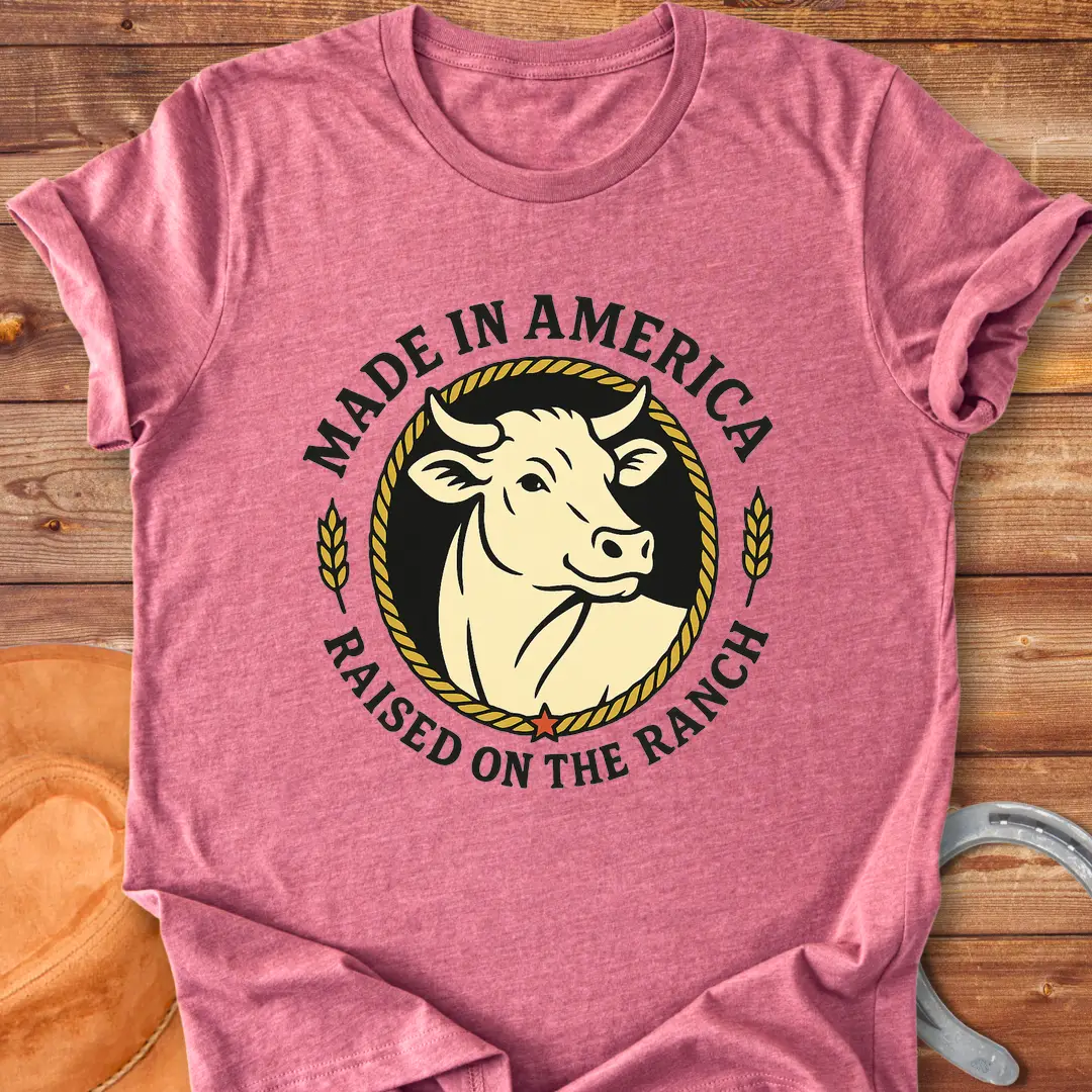 Raised on the Ranch t-shirt featuring a cow illustration and patriotic elements