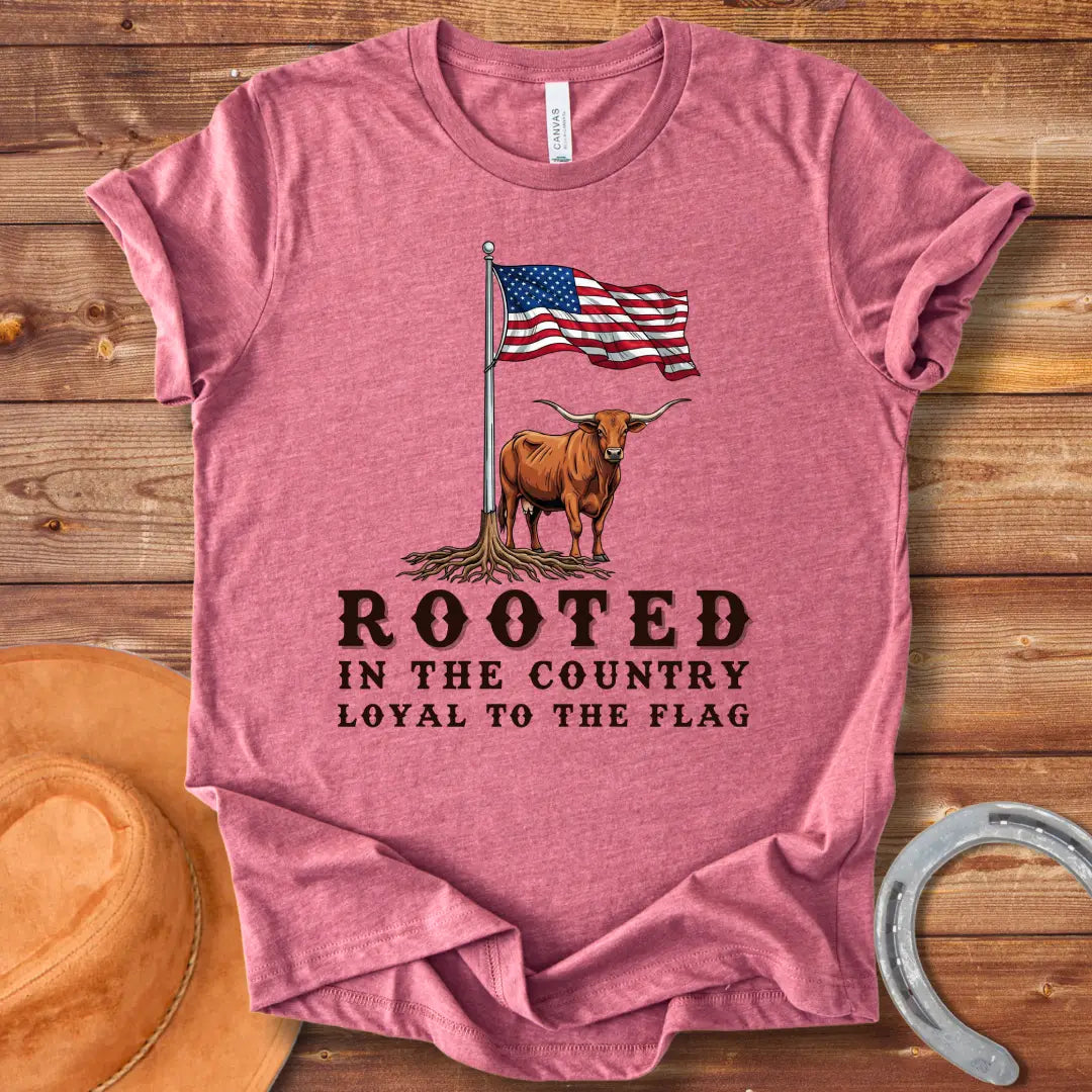 Rooted in the Country T-Shirt featuring a longhorn with roots and the American flag, representing country pride.
