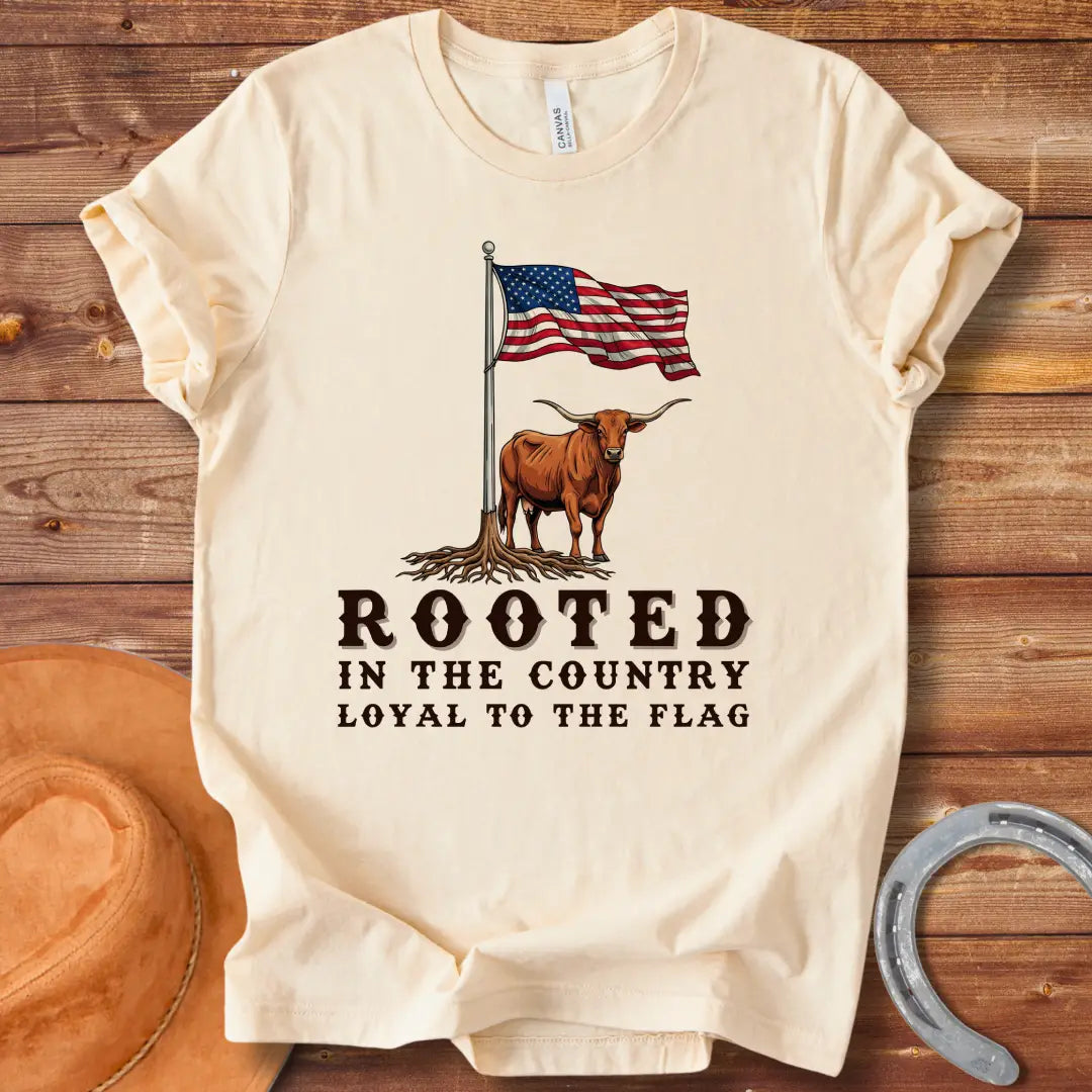 Rooted in the Country T-Shirt featuring a longhorn with roots and the American flag, representing country pride.