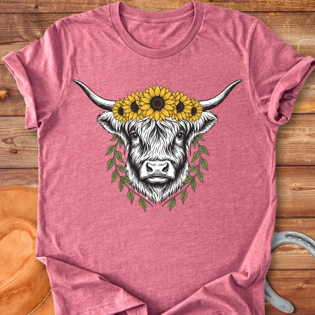 Rustic illustration of a Highland cow wearing a sunflower crown and leafy wreath, perfect for cow lovers.