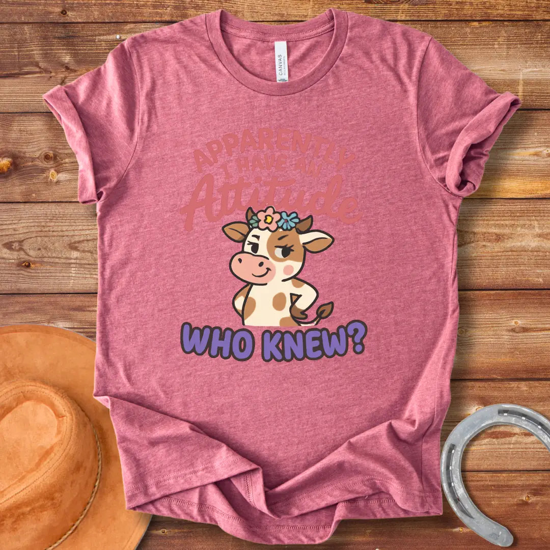 Illustration of a sassy cow wearing a floral crown and winking, with the words 'Apparently I Have An Attitude. Who Knew?'