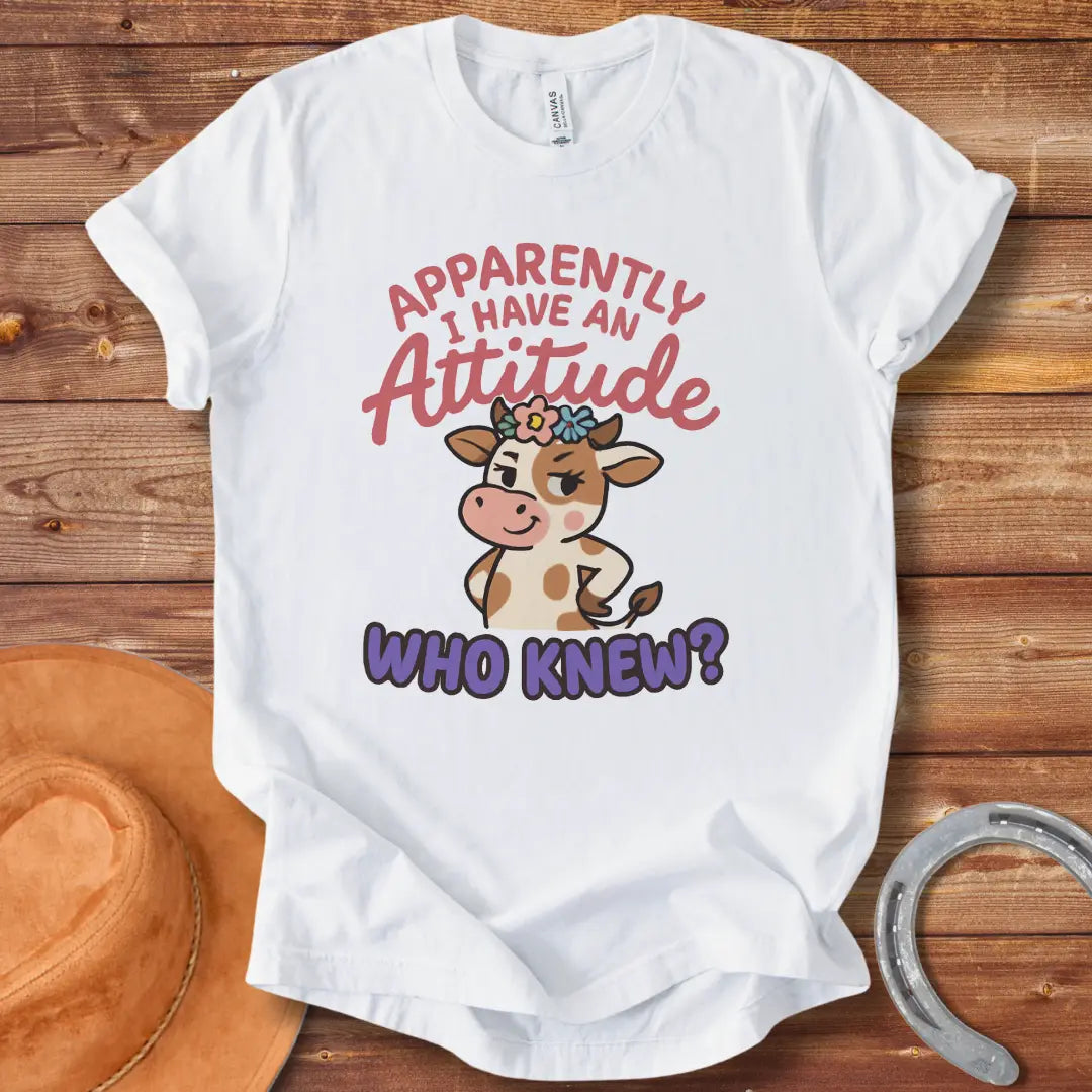 Illustration of a sassy cow wearing a floral crown and winking, with the words 'Apparently I Have An Attitude. Who Knew?'