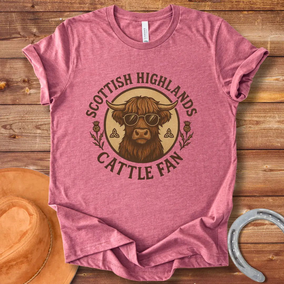 Scottish Highland cow wearing sunglasses, surrounded by text and thistle artwork