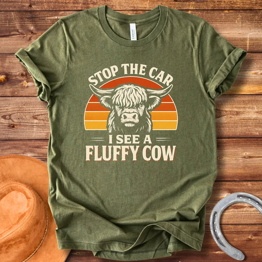 Vintage-style t-shirt design with a fluffy cow, the text 'Stop the Car, I see a Fluffy Cow' in a retro design.