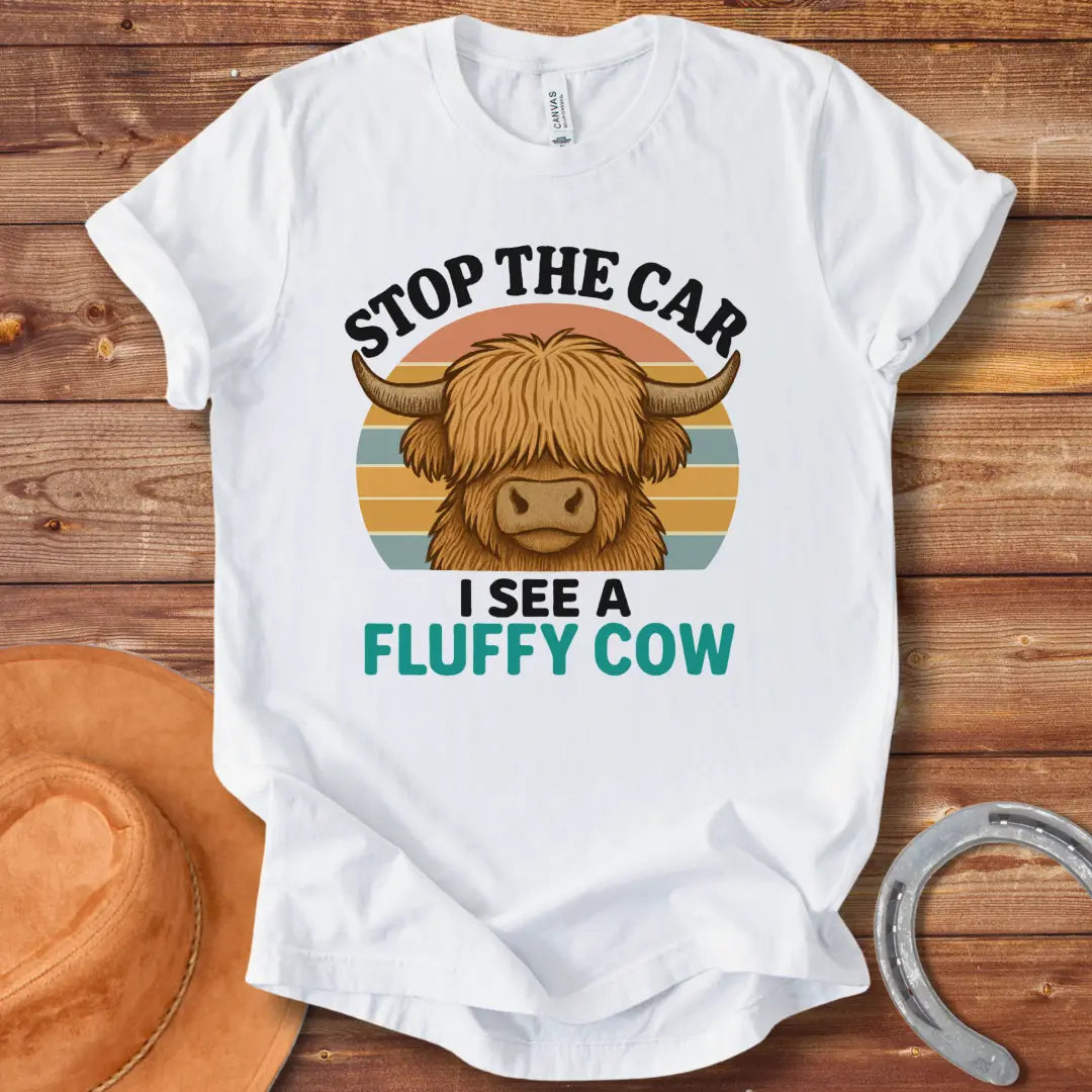 Retro t-shirt with a fluffy highland cow, the text reads 'Stop the Car I See a Fluffy Cow'