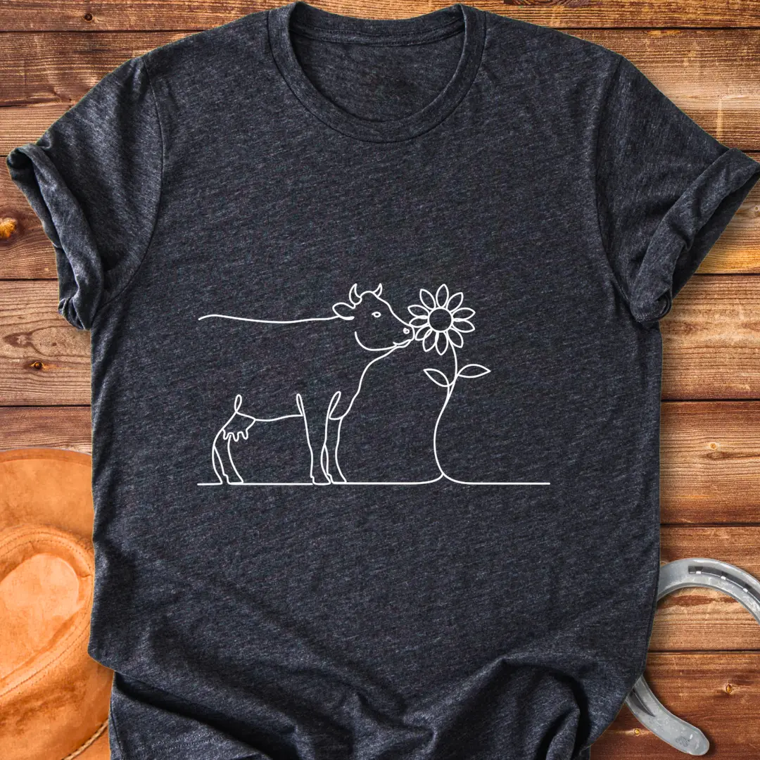 Line art illustration of a cow kissing a sunflower, a Cow Lovers Clothing product