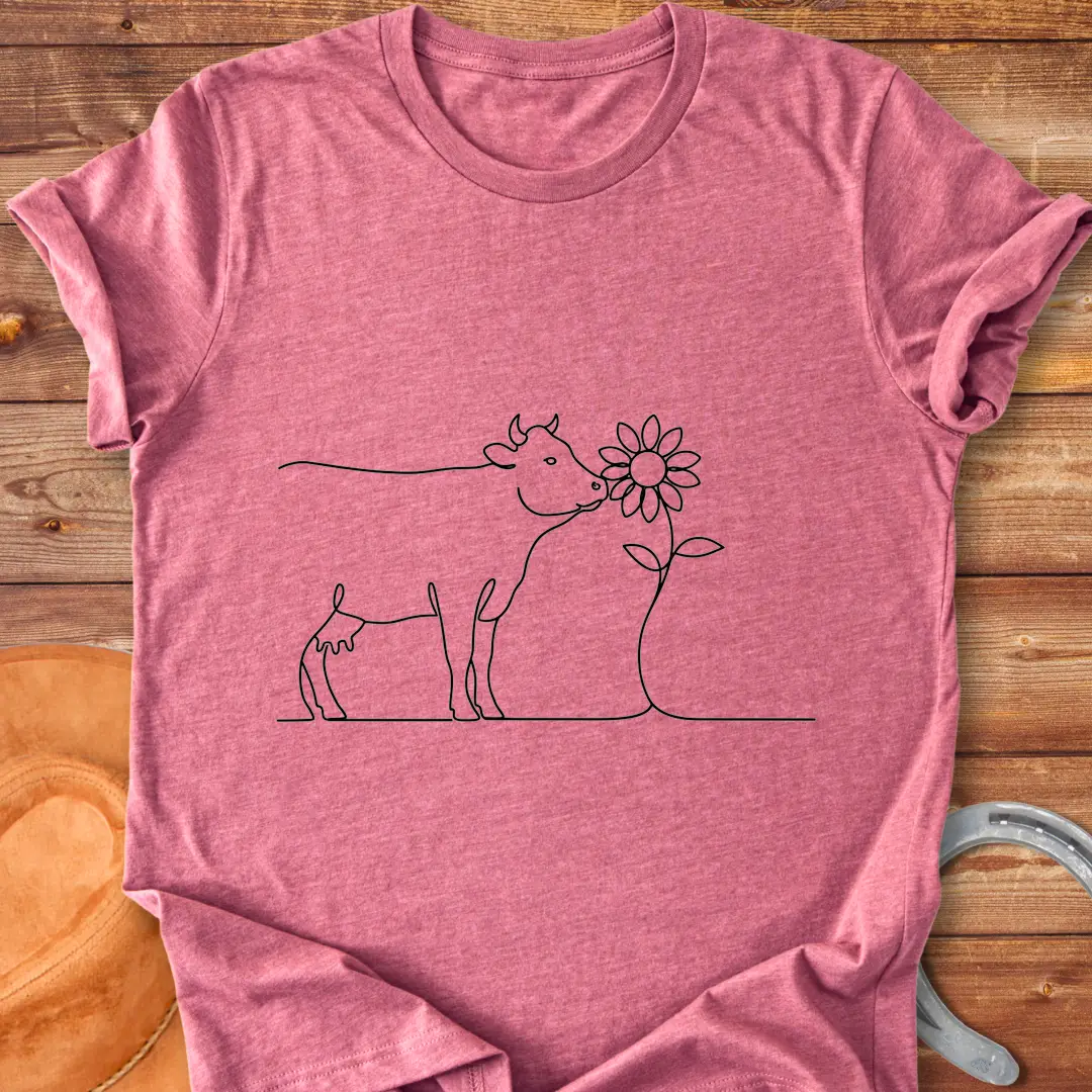 Line art illustration of a cow kissing a sunflower, a Cow Lovers Clothing product