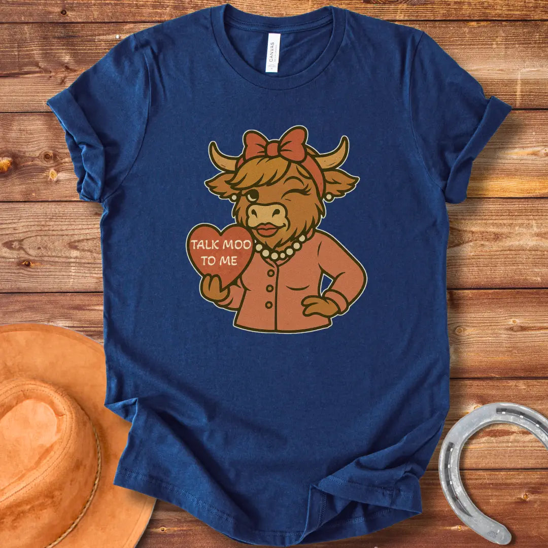 Talk Moo To Me T-Shirt design featuring a stylish winking cow holding a heart