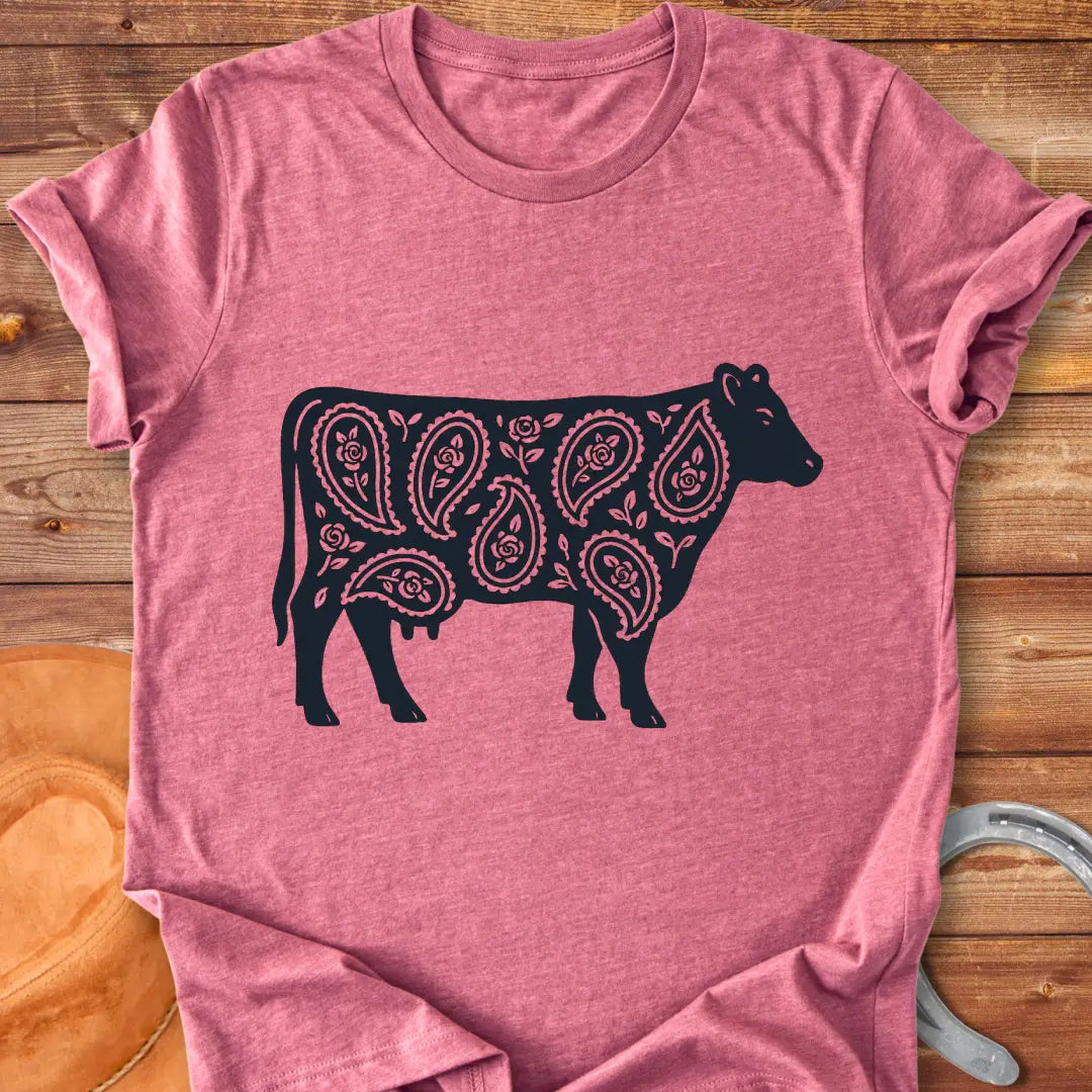 Black cow silhouette with paisley teardrop and rose floral pattern