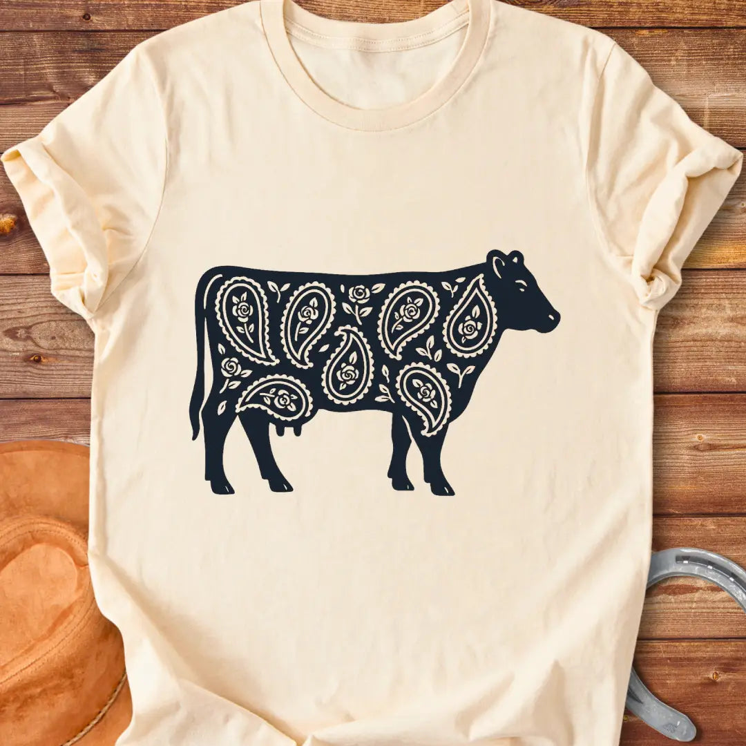 Black cow silhouette with paisley teardrop and rose floral pattern