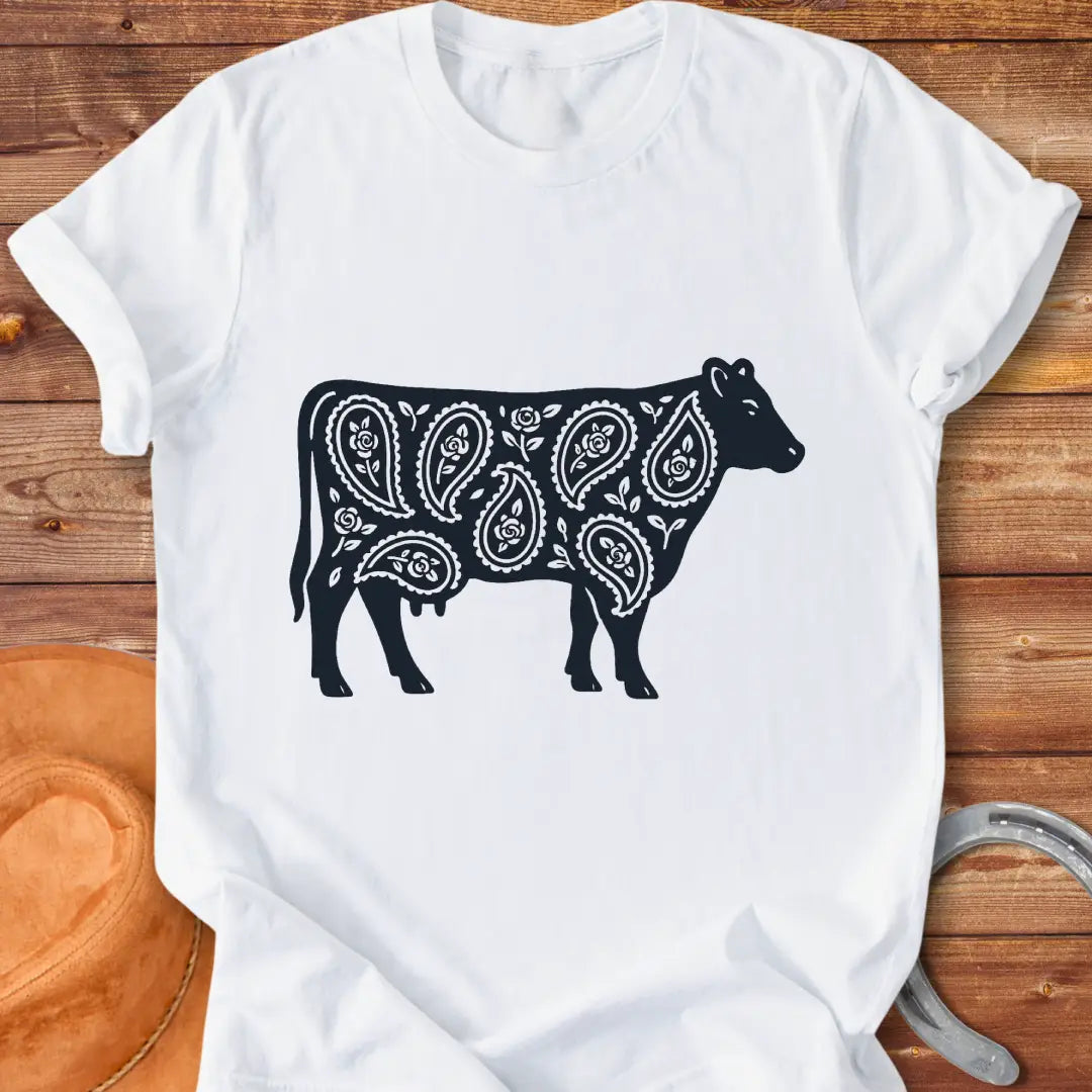 Black cow silhouette with paisley teardrop and rose floral pattern