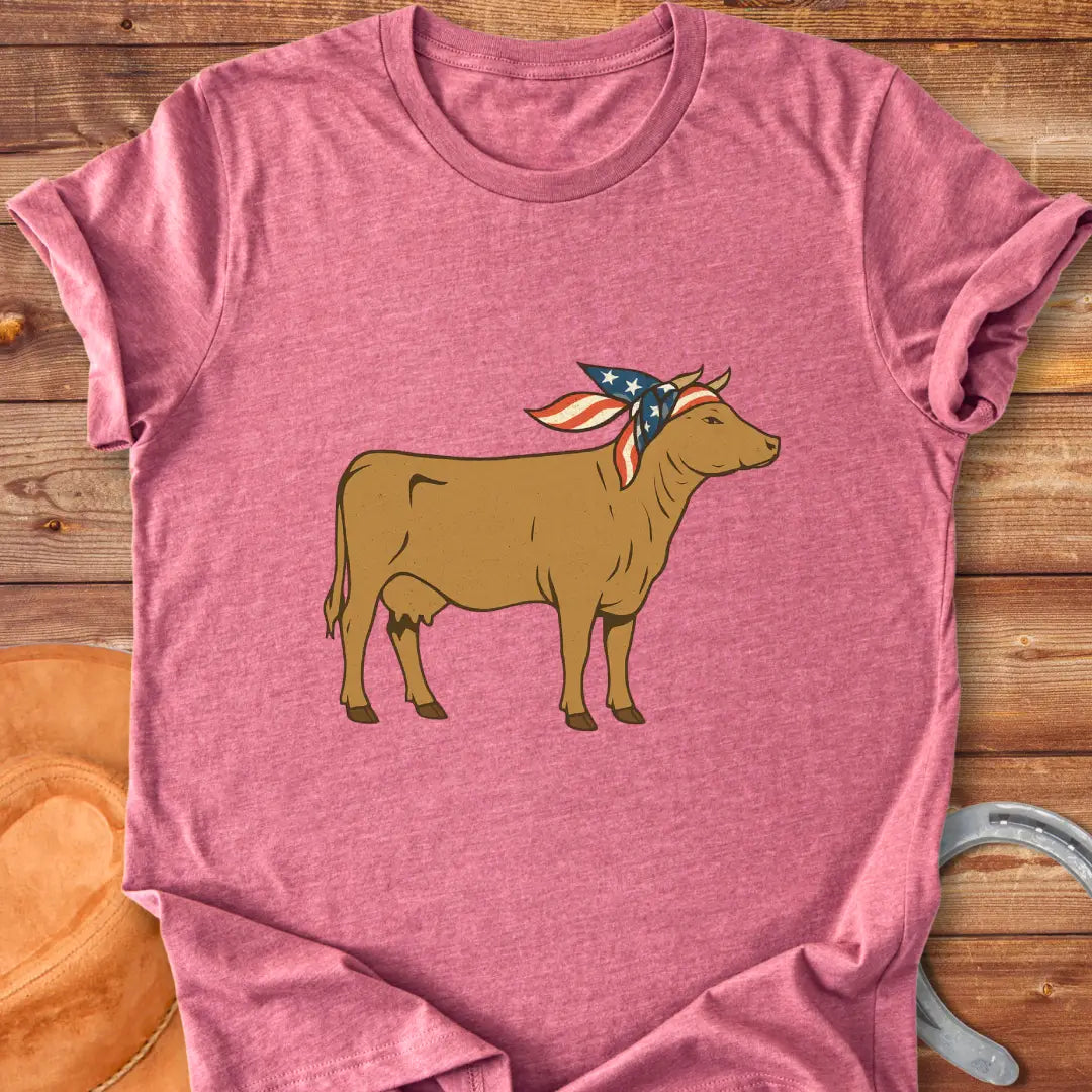 USA Cowgirl T-Shirt featuring a brown cow wearing an American flag bandana, patriotic cow design