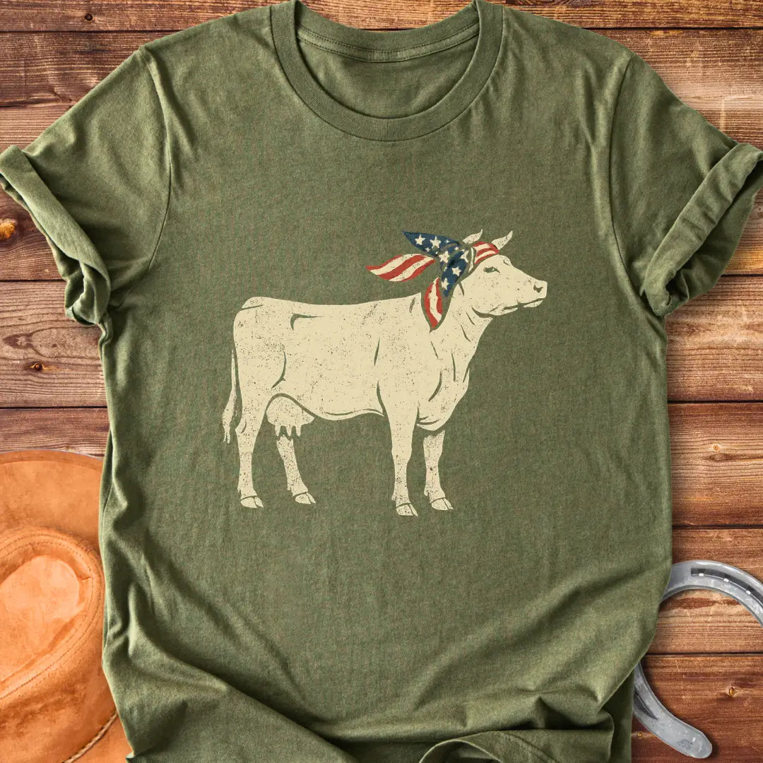 USA Cowgirl T-Shirt featuring a brown cow wearing an American flag bandana, patriotic cow design