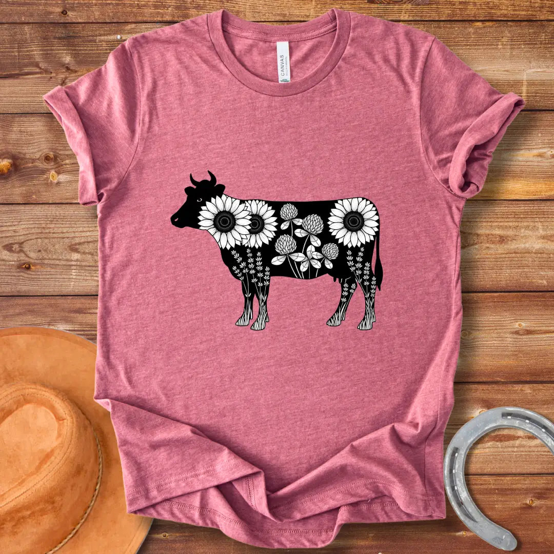 Black and white illustration of a cow filled with sunflowers, clover and lavender flowers