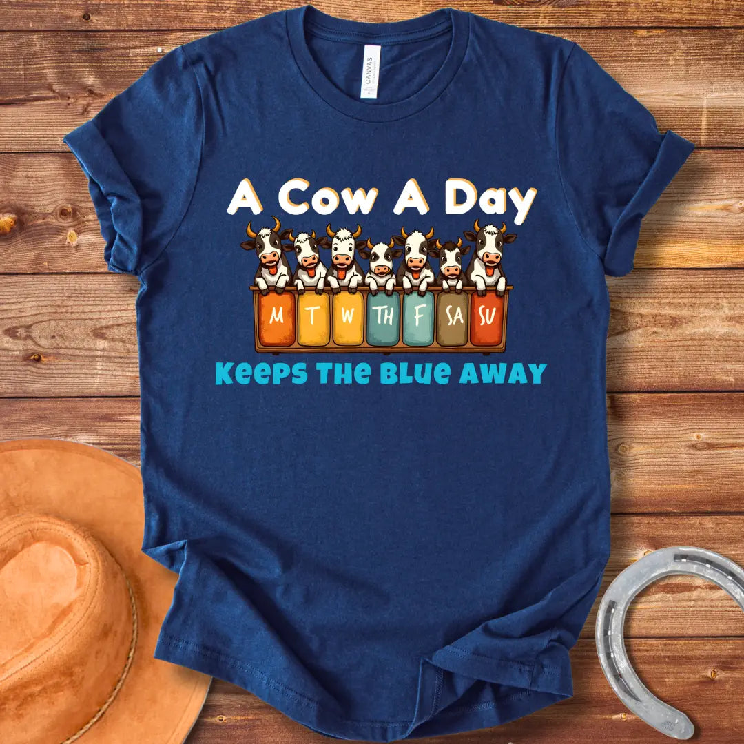 Illustration of seven happy cows each peeking over a box holding days of the week, the text at the bottom saying 'Keeps the Blue Away'.