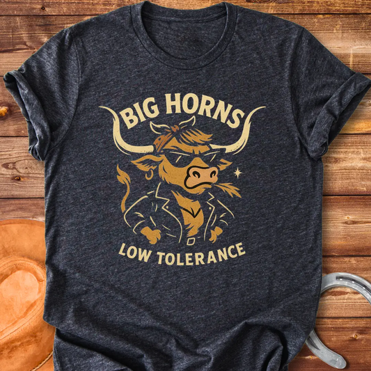 A cool cow wearing sunglasses and a leather jacket, with the words 'Big Horns Low Tolerance'.