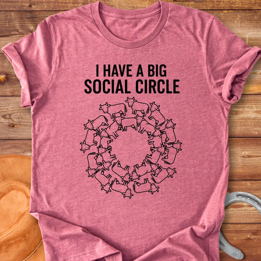 T-shirt with the words 'I have a big social circle' above a circular arrangement of cow illustrations.