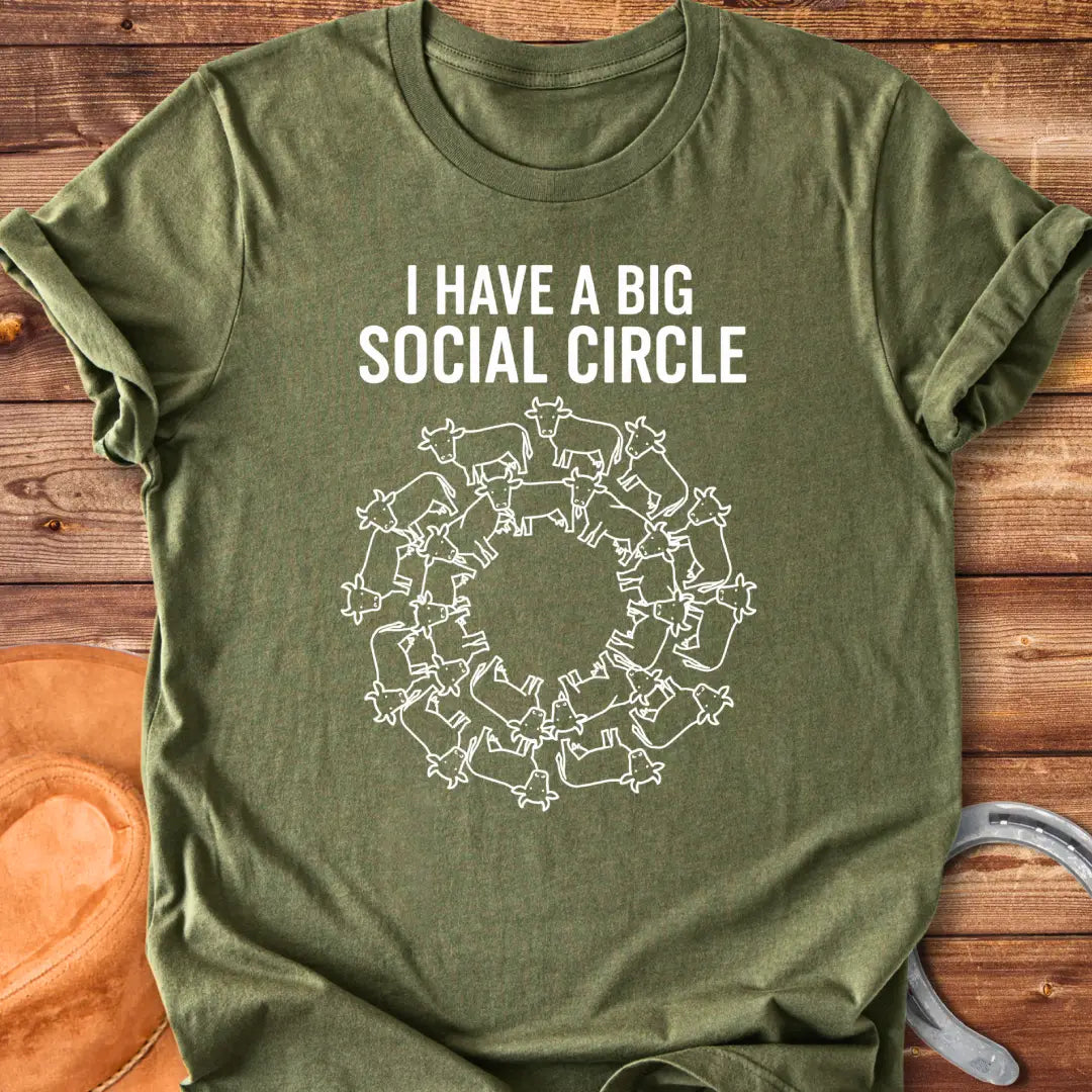 T-shirt with the words 'I have a big social circle' above a circular arrangement of cow illustrations.