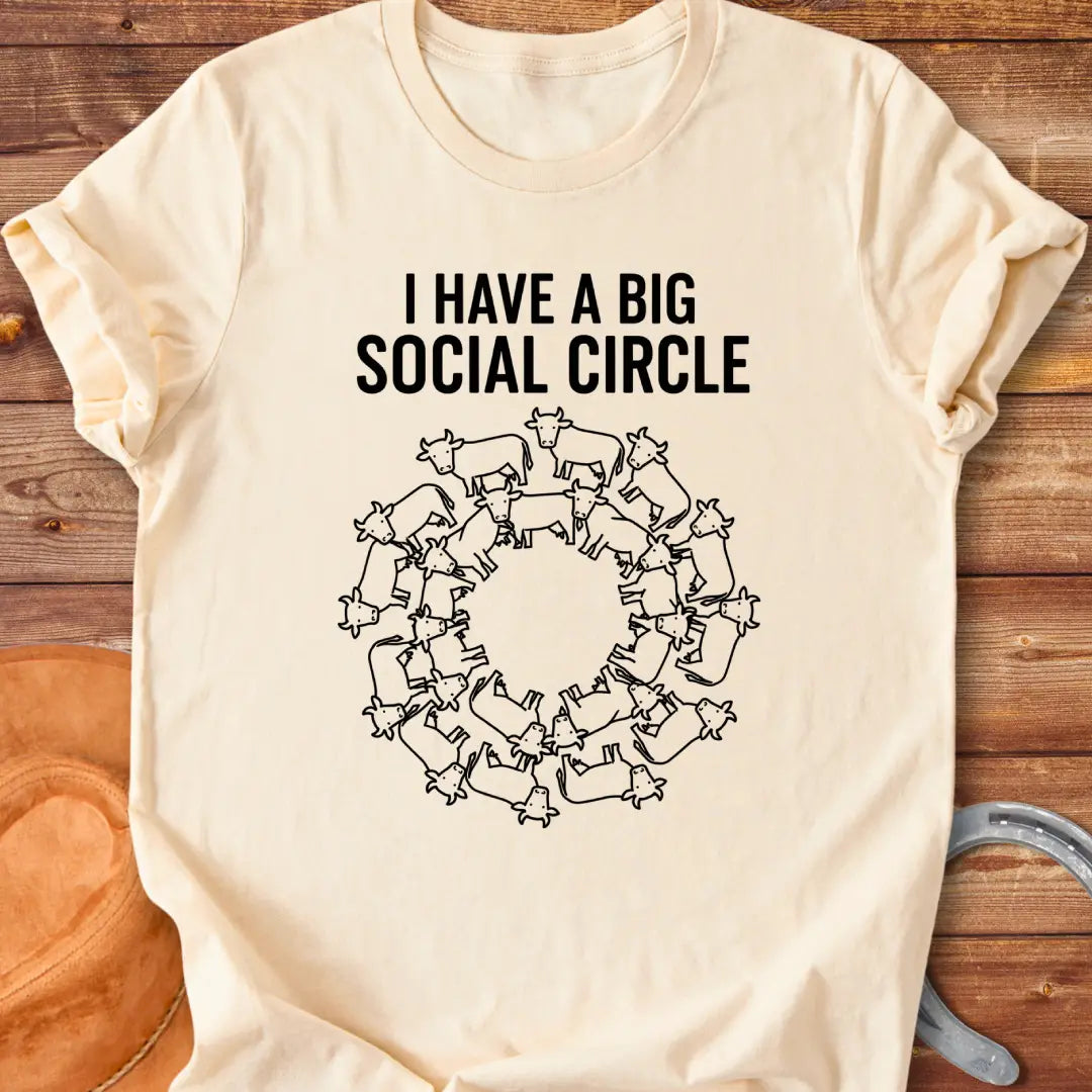 T-shirt with the words 'I have a big social circle' above a circular arrangement of cow illustrations.