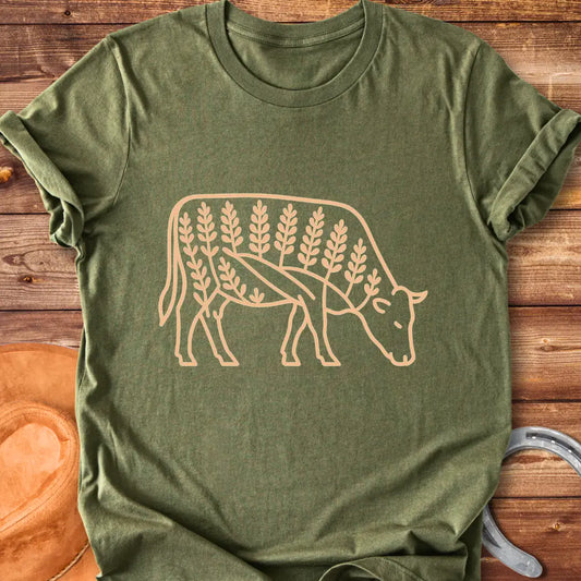 Bluebonnet cow illustration t-shirt design, showing a cow with floral elements within its silhouette.