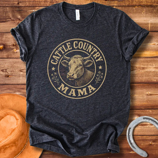 A sepia-toned illustration of a cow's head, surrounded by a circular design that reads 'Cattle Country Mama'.
