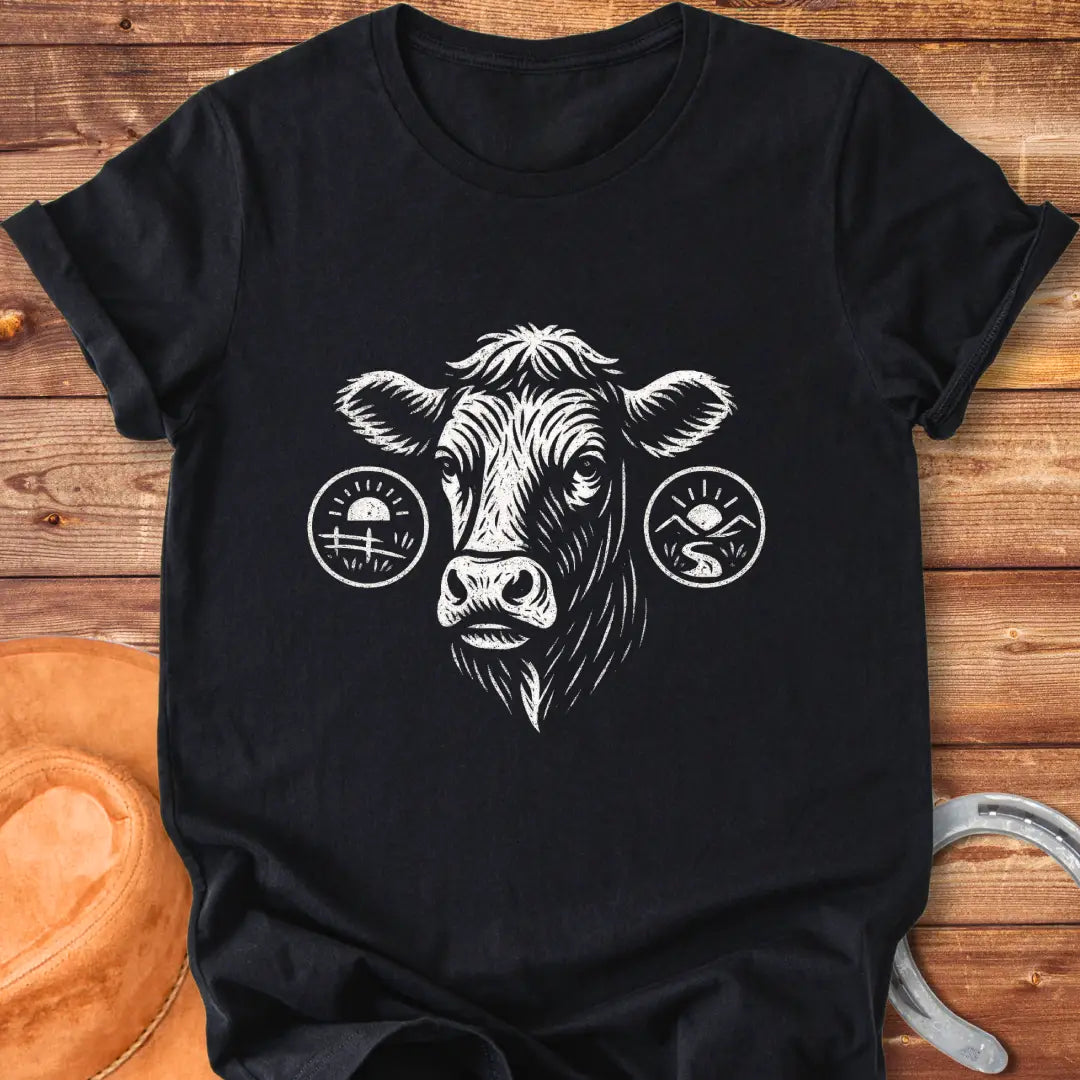Cattle head silhouette with sunrise, valley, and farmland details, illustration t-shirt design.