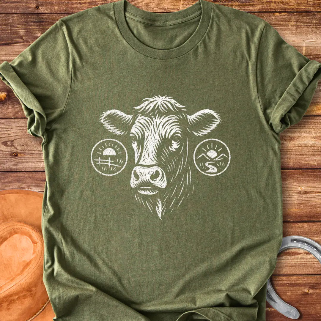 Cattle head silhouette with sunrise, valley, and farmland details, illustration t-shirt design.
