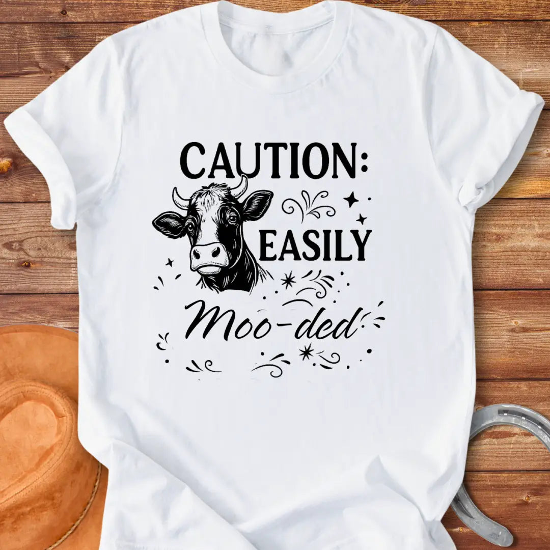 Caution: Moo-ded T-shirt featuring a detailed cow illustration with decorative elements.