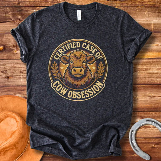Illustration of a fluffy cow with the words 'Certified Case of Cow Obsession' around it.