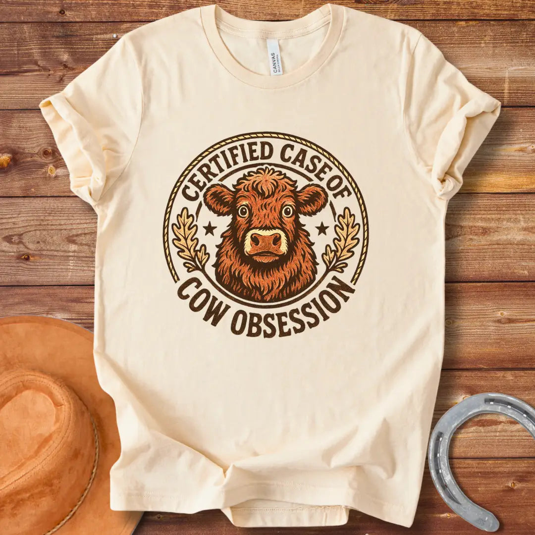 Illustration of a fluffy cow with the words 'Certified Case of Cow Obsession' around it.